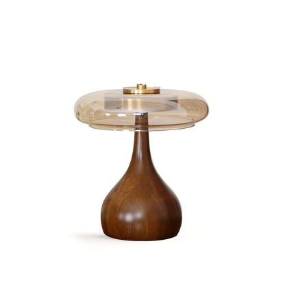 De Pirevo glazen tafellamp is een verfijnde combinatie van glas, messing en hout